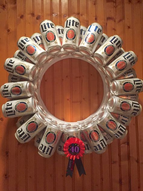 https://flic.kr/p/BJQ3sC | Beer Can Wreath | I made this Beer Can Wreath for my wife's 40th Birthday party. It's made out of 32 can of her favorite beer, styrofoam wreath from a craft store, lot of hot glue, and a 40th ribbon from Party City. I got the idea from  a Google images search and it was super easy to make. Beer Can Wreath, Beer Wreath, Can Wreath, Beer Party Theme, Beer Crafts, Beer Birthday Party, White Trash Party, School Function, 40th Bday Ideas