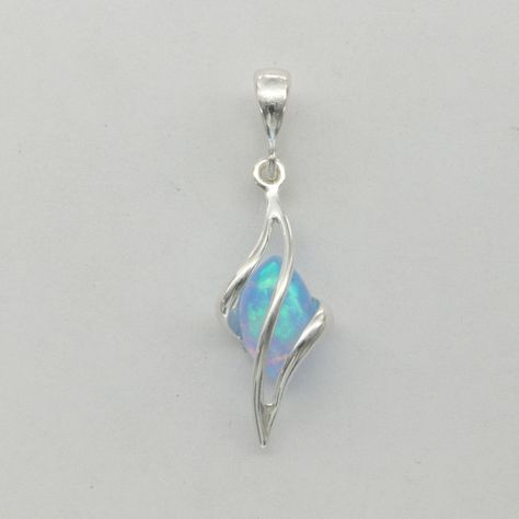 This is a lab created Fire Opal pendant. The pendant is made out of solid 925 Silver and there is no nickel or other substances causing most allergies. This makes the earrings hypo allergenic. The size of the pendant - incl. bail - is 3.1 x 1.0 cm or 1.22 x 0.39 inch You will receive the item in a gift box - perfect to surprise someone or yourself. Usually we ship on the same day we receive the payment for the order. We want you to be happy with your purchase. If you do not like what you bough c Fire Opals, Blue Fire Opal, Aesthetic Jewelry, Magical Jewelry, Ring Ideas, Wire Pendant, Jewelry Images, Blue Fire, Pretty Rings