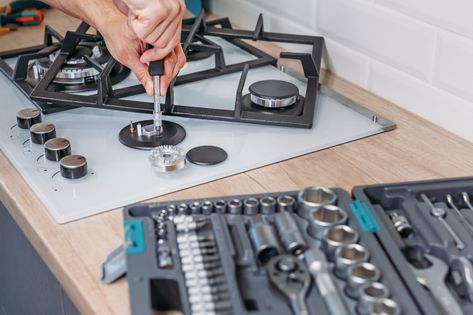 Man's hand repairs hotplate of gas panel... | Premium Photo #Freepik #photo #hand #kitchen #home #work Gas Stove Repair, Best Gas Stove, Microwave Repair, Stove Repair, Fridge Repair, Oven Repair, Washing Machine Repair, Refrigerator Repair, Appliance Repair Service