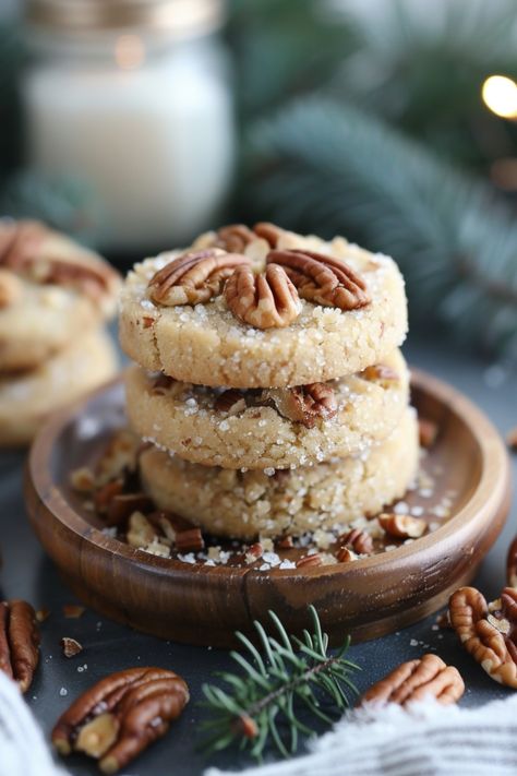 Three pecan-topped butter cookies stacked on a wooden plate, surrounded by pecans and greenery. Pecan Sandies Recipe, Pecan Sandies Cookies, Sandies Cookies, Sandies Recipe, Pecan Sandies, Lemon Cookies Recipes, Beautiful Text, Pecan Ice Cream, Decadent Chocolate Cake