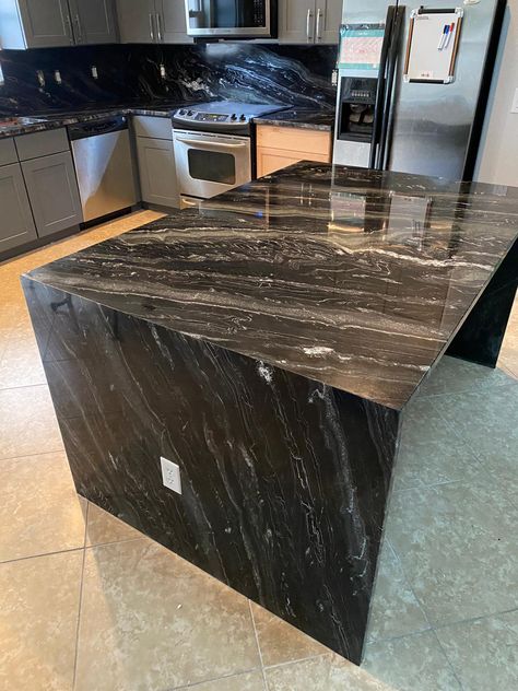 Black Granite Island, Quartzite Countertops Kitchen, Waterfall Island Kitchen, Kitchen Quartz, Granite Quartz Countertops, Waterfall Island, Kitchen Granite, Granite Island, Black Granite Countertops