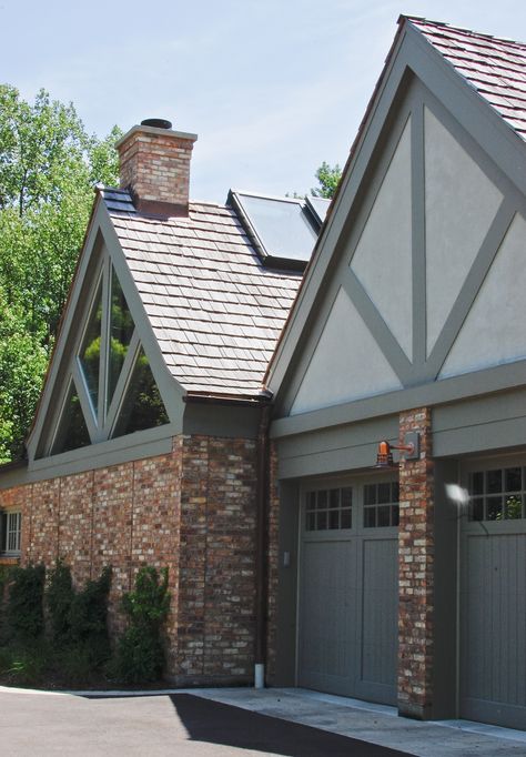 Addition/renovation of 1930's tudor home. Family room, exercise room, "spa" room & 2 car garage. Chicago common brick, painted cedar, stucco & wood shake roof to match original house. North elevation drive-way & side entry to addition/renovation. Tudor Style Garage Doors, Modern Tudor Exterior Paint Colors, Tudor Exterior Makeover, English Tudor House Exterior, Tudor Garage, Tudor Exterior Paint, Tudor Exterior, Brick Paint Colors, Exterior Paint Colours