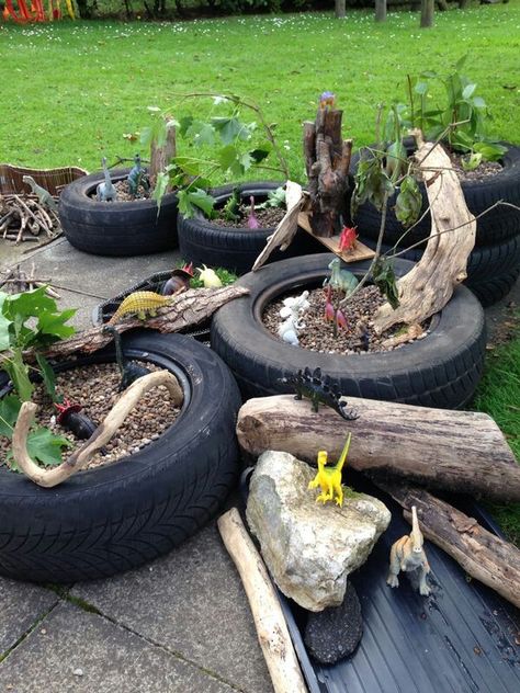 Tire Outdoor Play, Outdoor Small World Play, Outside Small World Area Eyfs, Small World Tyre Ideas, Small World Outdoors Eyfs, Small World Dinosaurs Eyfs, Small World Tyres, Outdoor Dinosaur Play Area, Outdoor Small World Eyfs