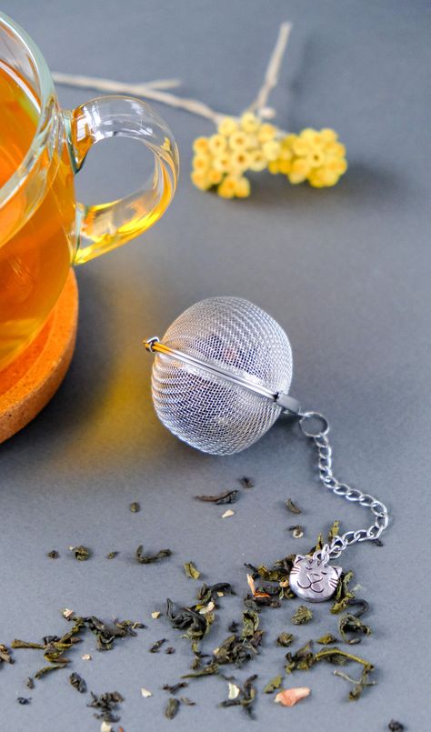 These tea ball Infuser are a great way to enjoy whole leaf tea and makes a cute gift for any tea drinker tea teatime teaballInfuser TeaStrainer TeaInfuser Brighton Townhouse, Tea Balls, Table Wear, Afternoon Tea Parties, Herbal Infusion, Red Bird, Reduce Food Waste, Tea Strainer, Tea Gifts