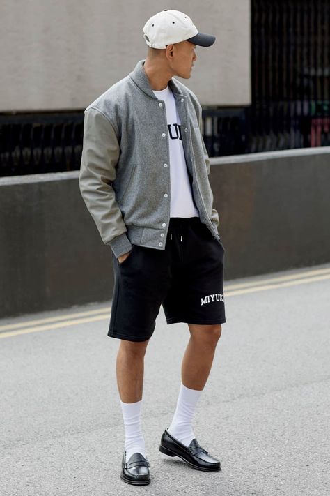 Varsity Jacket Outfit With Shorts, White Socks Men Outfits, Loafers With Shorts Mens, Penny Loafers Men Outfit Streetwear, Shorts And Loafers Men, Loafers And Shorts Outfit Men, Mens Penny Loafers Outfit, Black Penny Loafers Men Outfit, Preppy Outfits For Men