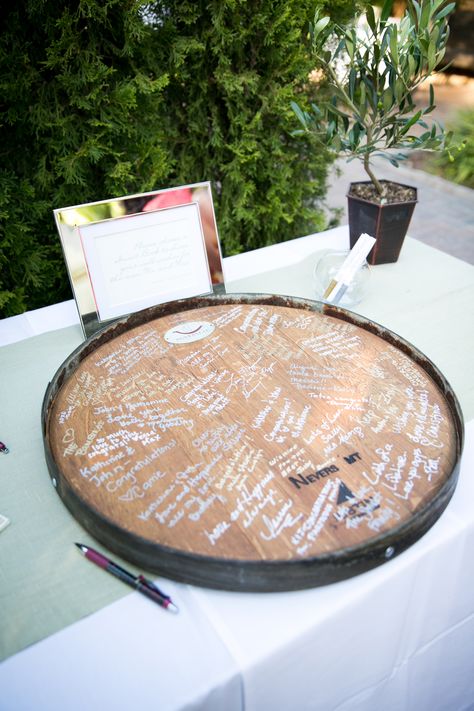 The pair had a reclaimed wine barrel converted into a lazy Susan upon which friends and family wrote their well wishes and advice.