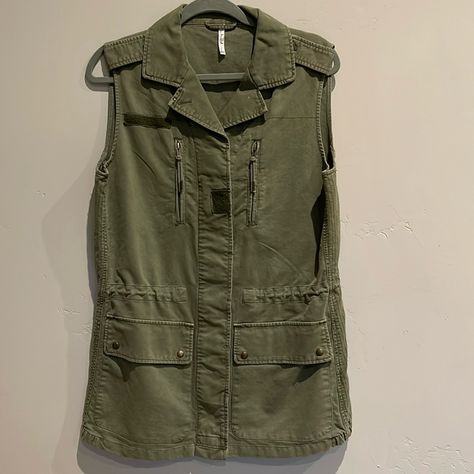 Army Green, Cargo Vest, Collar, Button And Zipper Front, Functional Zippered Chest Pockets, Functional Snap Flap Patch Pockets, Adjustable Toggle Waist, Velcro Strip At Hem Chest 42in Length. 29in Nwots Military Vest, Utilitarian Wear, Nordstrom Green Cargo Vest, Combat Vest, Brown Fur Vest, Military Vest, Faux Leather Vest, Cargo Vest, Zipper Vest, Brown Vest, Style Vest