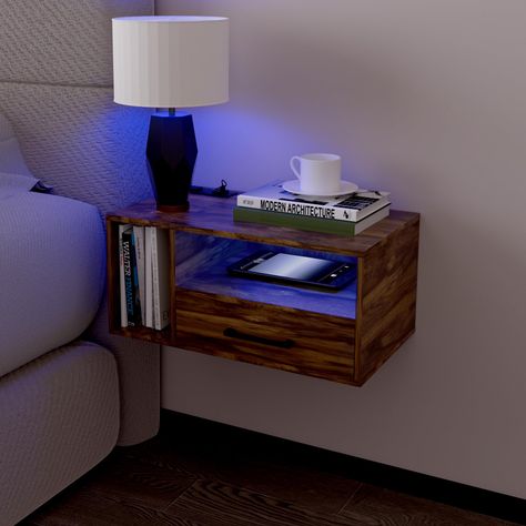 PRICES MAY VARY. NIGHTSTAND WITH LED LIGHTS: The dreamy floating Nightstands Lighting Designs(16 Static Colors,4 Dynamic Modes) brightness can be adjusted,you will always find your favorite light to raise bedroom vibes. It will create a fantastic ambiance in your bedroom in the dark. CONVENIENT CHARGING: The bedside table is equipped with 2 USB ports and 1 AC outlets, making it a breeze to charge your phone, electronics equipment. Concealed wire design prevents cable clutter. A set is always bet Floating Nightstand Drawer, Raised Bedroom, Bedside Table With Drawers, Nightstand Lighting, Floating Nightstands, Floating Shelf With Drawer, Floating Bedside Table, Bedroom Vibes, Nightstand With Charging Station