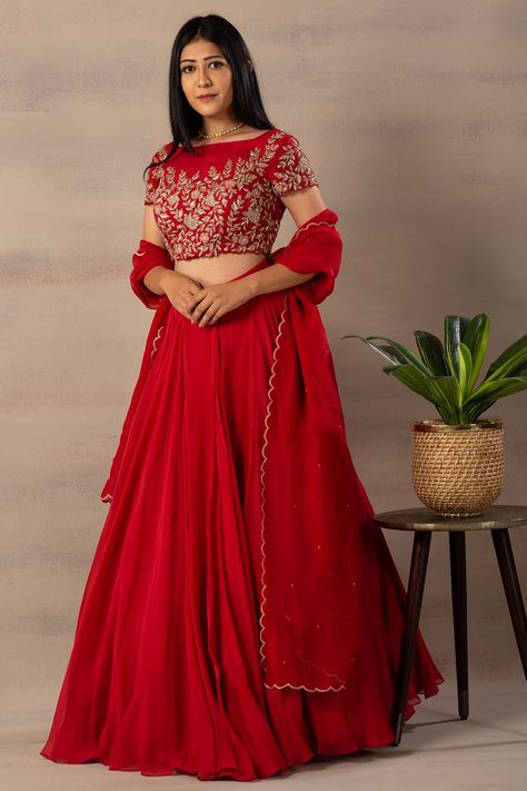 Featuring a red crop top in organza base with cutdana and thread embroidery. It is paired with a matching lehenga and a dupatta.  FIT: Fitted at bust and waist. COMPOSITION: Organza. CARE: Dry clean only. Reka Bentuk Blaus, Gown Dress Party Wear, Lengha Blouse Designs, Lehenga Top, Baju Kahwin, Lehenga Crop Top, Crop Top Lehenga, Simple Lehenga, Lehenga Saree Design