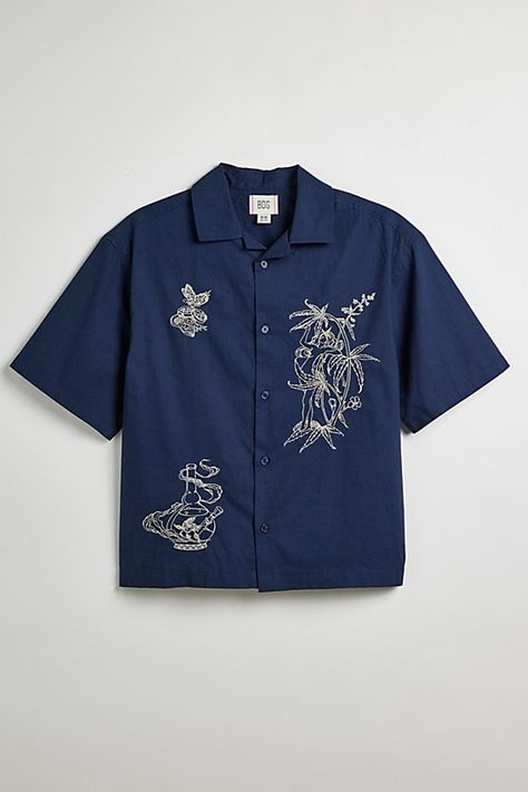 BDG Reefer Fairy button-down shirt. Short sleeve shirt with a standard collar. Urban Outfitters exclusive. Features Reefer Fairy embroidered short sleeve shirt Button-down front Standard collar UO exclusive Content + Care 100% Cotton Machine wash Imported Size + Fit Model is 6'0" and wearing size Medium | BDG Reefer Fairy Embroidered Shirt Top in Navy, Men's at Urban Outfitters Button Up Shirt Outfit Mens, Button Up Streetwear, Work Shirt Men, Queer Clothes, Vacation Outfits Men, Logger Boots, Embroidered Apparel, Mens Tops Fashion, Collar Shirt Men