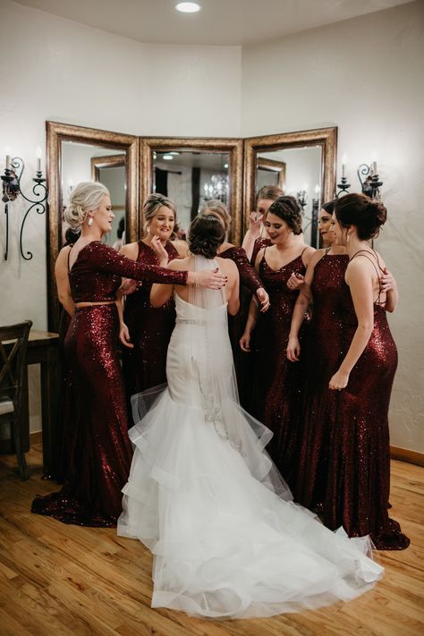 | bridesmaid first look | bridal suite photo ideas | unique wedding day ideas | bridesmaids' reactions after seeing the bride in her wedding dress for the first time | classy bridesmaids in deep red | maroon, shimmery bridesmaid dresses | elegant wedding | brides of houston | houston wedding venue | photo taken at THE SPRINGS Event Venue. follow this pin to our website for more information, or to book your free tour! SPRINGS location:  Stonebrook Hall in Lake Conroe, TX Angela Nobles Photography Christmas Theme Bridesmaid Dresses, Red Bridesmaids Dresses Winter, Christmas Red Bridesmaid Dresses, Christmas Wedding Bridesmaids Dresses Long Sleves, Winter Wedding Red Bridesmaid Dresses, Winter Wonderland Dress, Bridal Party Outfit, Wedding Venue Houston, Spring Event