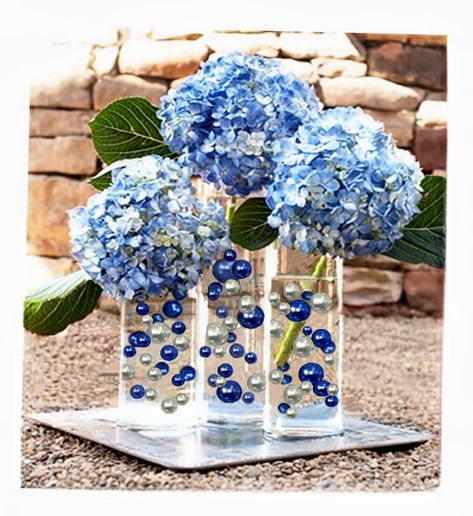 PRICES MAY VARY. Transform ordinary vases into EXTRAordinary centerpieces with these Eye-catching vase decorations. Great for wedding centerpieces, Hanukkah, mitzvahs, graduations, bridal showers, birthdays, gifts, and much more... Fills 4 gallons of 250 Floating Pearls and the most Transparent Gels for your vases! Contains:100 Blue Pearls and 80 Silver Pearls all with no holes and shiny, 16 Jumbo 30mm (1 1/4"), 32 Large 20mm (3/4"), and 132 medium (14mm/0.5") + 4 Packets of the most Transparent Vase Decorations, Floating Centerpieces, Blue Themed Wedding, Azul Real, Vase Fillers, Fairy String Lights, Floating Candles, Blue Pearl, Centerpiece Decorations