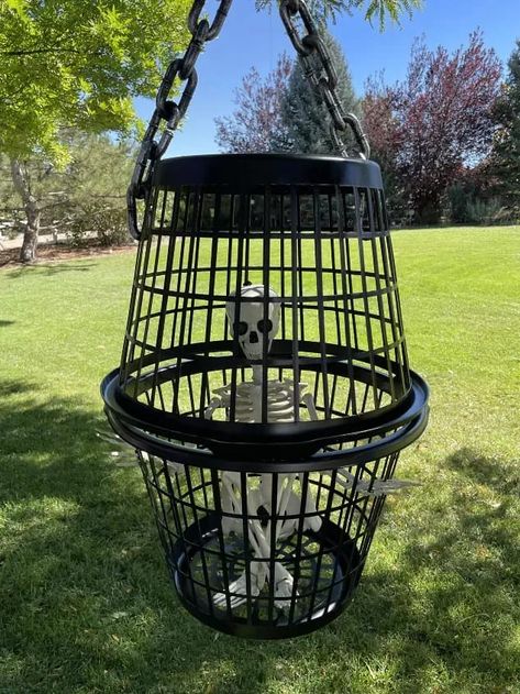 Halloween is one of my favorite holidays! I'm making an inexpensive laundry basket cage as part of this year's Halloween decor for our awesome trick or treaters! You can see more of my crazy creations here You'll need 2 laundry baskets and preferably black. I bought mine from Dollar Tree and they didn't have black laundry baskets so I sprayed both of mine with Rustoleum black spray paint inside and out. Next, I purchased a skeleton from Walmart and placed him inside one of the laun… Skeleton Decorations Outdoor, Dollar Tree Halloween Crafts, Scary Halloween Props, Black Laundry Basket, Yard Decoration Ideas, Halloween Props Scary, Black Laundry, Diy Laundry Basket, Dollar Tree Halloween