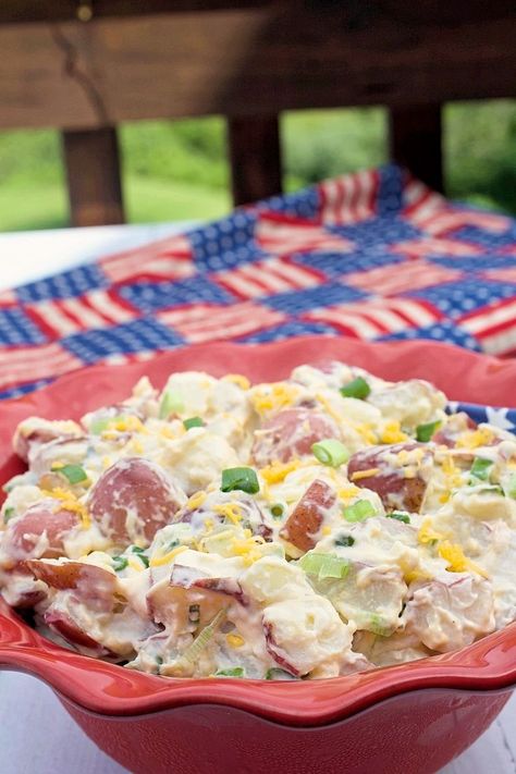 A red bowl of Steakhouse Potato Salad sitting on a picnic table. Steak Potato Salad, Country Potato Salad, Steak House Potatoes Salad, My Country Table Recipes, Steakhouse Potato Salad, Steakhouse Potatoes, Recipe With Sour Cream, Steakhouse Recipes, Brunch Salad