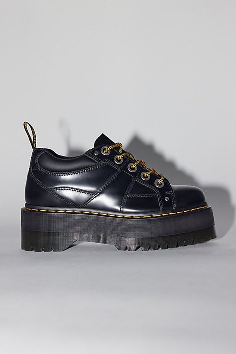 Dr. Martens 5-Eye Quad Max shoes. Extra-stompy Quads from Dr. Martens. 5-eye shoe by Dr. Martens made with a padded collar and air-cushioned sole, now with an empowering max platform and premium leather. Complete with a Goodyear welt and classic Docs DNA like grooved edges and visible stitching. Features Dr. Martens 5-Eye Quad Max shoes Platform Docs with a Quad Max sole Lace-up style Content + Care Leather, rubber Spot clean Imported Size + Fit Platform: 1.75" Heel: 2.25" | Dr. Martens 5-Eye Quad Max Shoe in Black, Women's at Urban Outfitters Dr Martens Quad, Doc Marten Platform, Doc Marten Shoes, Platform Docs, Platform Dr Martens, Black Doc Martens, Platform Doc Martens, Doc Martens 1460, Dr Martens Platform