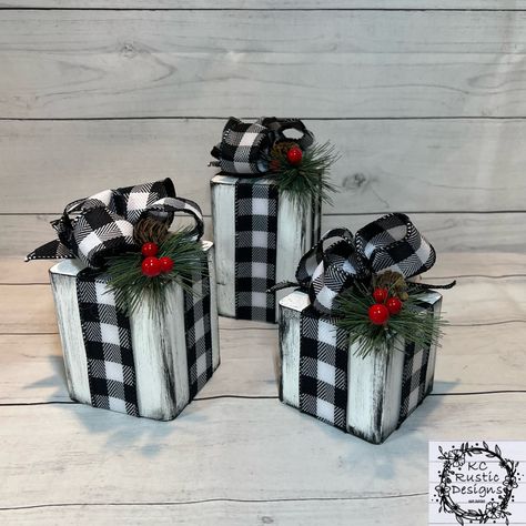 "These beautiful square wooden Christmas presents are perfect for your Christmas decor. They are perfect to add to any space!  You'll be getting a trio. They measure approximately: Large present is 5\" X 3.5\" Medium present is 4\" X 3.5\"  Small present is 3\" X 3.5\" With the ribbon and greenery on top gives about another inch in height. These are solid and heavy.  All are hand painted. I use buffalo plaid ribbon, greenery, berries and a pinecone to decorate these adorable wooden presents. All Wood Christmas Gifts, Wooden Christmas Presents, Wooden Presents, Wood Blocks Christmas, Decoration Buffet, Buffet Decor, Presents Christmas, Country Christmas Decorations, Christmas Wood Crafts