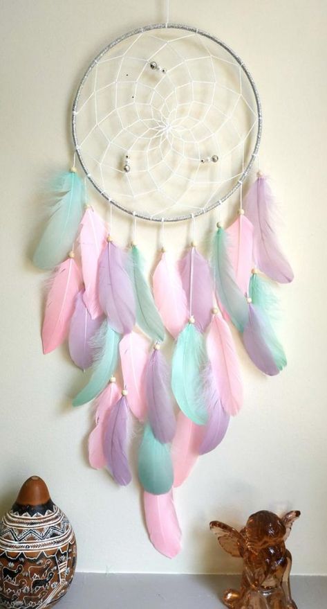 his beautiful white gold feather dream catcher is the perfect eye-catching piece you need for your home. It also perfect for a baby nursery, bedroom wall decor, bohemian/tribal home decor. The dream catcher ring width 9 inches ( 23 cm.) Overall length including hanging loop 31 i This large dream catcher is made of a metal ring wrapped in a silver ribbon. #dreamcatcher #babyshower #nurserydecor #bohobedroom #bohodecor #feathers #largedreamcatcher #bohonursery #walldecor #unicorndreamcatcher Dream Catcher Pink, Atrapasueños Diy, Gold Nursery Decor, Doily Dream Catchers, Diy Dream Catcher Tutorial, Dream Catcher Tutorial, Dream Catcher Patterns, Blue Dream Catcher, Dream Catcher Nursery