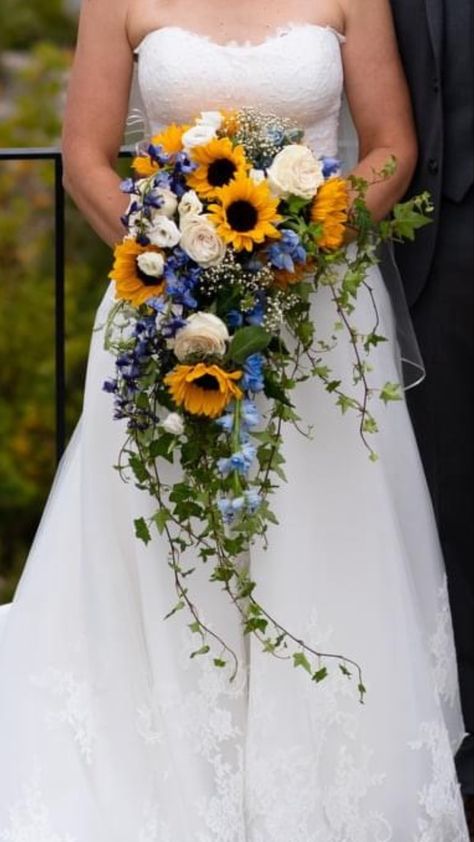 Sunflower And Bluebonnet Bouquet, Sunflower Cascade Bouquet, Sunflower Wild Flower Wedding Bouquet, Sunflower Wedding Bouquet Blue, Sunflower Hydrangea Bouquet, Wedding Flowers Blue And Yellow, Cascading Sunflower Bridal Bouquet, Sunflower And Blue Wedding Theme, Hydrangea And Sunflower Bouquet