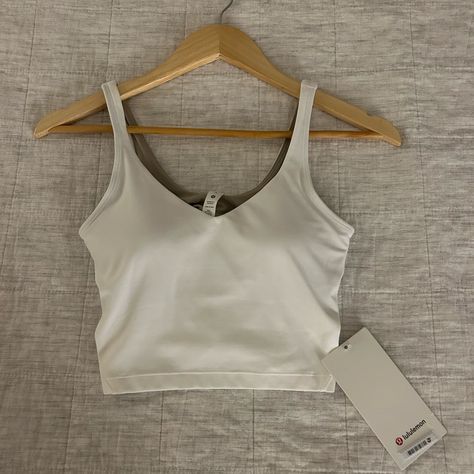 White Align Tank Size 4. Never Worn, New With Tags. White Align Tank, Lululemon Wishlist, Belly Shirts, Align Tank, Lululemon Align Tank, Align Top, 14th Birthday, Birthday List, Lululemon Align