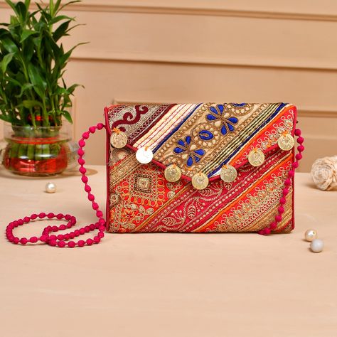 Sling Bag/Shoulder Bag for Ladies with Strap Color : Multicolor Size : 16 cm x 24 cm Material : Cloth Fabric Strap Style : Pink Colored Thread Style : Crossbody Sling Bag The Boho Coin Bag, a charming addition to the ensemble, features small embellishments like coins or beads that jingle softly as you move, adding a playful and rhythmic element to your style. This bag is not just a fashion accessory; it's a piece of art that tells a story of craftsmanship and cultural diversity. The Embroidered Evening Purse for Women is an elegant twist on the bohemian style, seamlessly transitioning from day to night. Its intricate embroidery and attention to detail make it a sophisticated choice for evening events, adding a touch of bohemian glamour to your ensemble. Bohemian Glamour, Handmade Clutch Purse, Bohemian Clutch, Saree Painting, Ethnic Bag, Handmade Clutch, Side Bag, Etsy Bridesmaid Gifts, Cultural Diversity