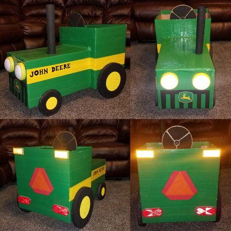 DIY 🚜 Handmade John Deere Tractor Costume made from cardboard boxes. Green & yellow duct tape to make it durable. Styrofoam tires, reflectors, laminated construction sign, push lights for headlights, laminated printed John Deere emblem. Cardboard grille & steering wheel. Tractor Costume, Cardboard Boxes Kids, Boys Halloween Costumes Diy, John Deere Birthday, Tractor Birthday Party, Cardboard Car, Tractor Party, Farm Craft, Farm Themed Birthday Party