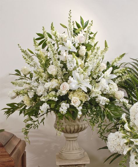 An abundance of fresh flowers including lilies, roses, snapdragons, delphinium, hydrangea, lisianthus, stock and larkspur are incorporated into this arrangement. It's a large arrangement that will be made in a plastic container, and displayed inside the urn, on a column for the memorial service.  The urn and column are not included in the purchase price of the flowers, and will be returned to Zeidler's.  sympathy, deceased, funeral, funeral home, flowers, casket spray, sprays, caskets, fami Classic Flower Arrangements, Pulpit Flower Arrangements Church, Tall Floral Arrangements For Home, Large Flower Arrangements For Home, Urn Floral Arrangements, Church Flower Arrangements Altars Ideas, Memorial Flowers Arrangements, Urn Flower Arrangements, Sympathy Flower Arrangements