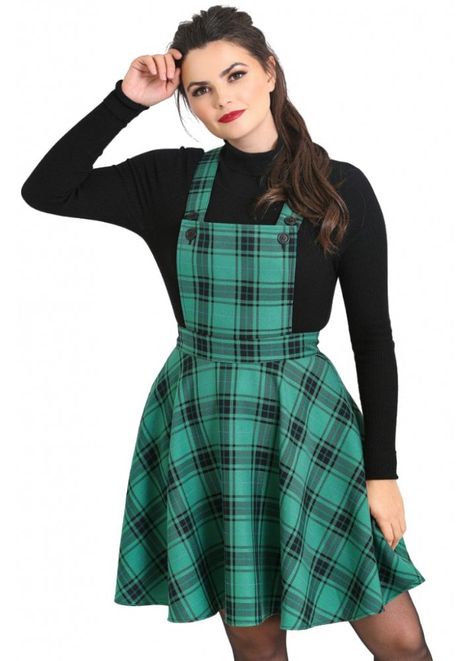 Hell Bunny's Brittany Pinafore Dress is a green and black tartan pinafore dress. This gorgeous green dress has a buttoned bib, a centre zip back and crossover straps.      Green and black tartan    Pinafore dress    Buttons on the bib    Adjustable crossover back    98% Polyester, 2% Viscose Alternative Dress, Attitude Clothing, Everyday Clothing, Pinafore Dress, Winter Clothing, Vintage Plaid, Dresses Uk, Green Plaid, Clothing Ideas