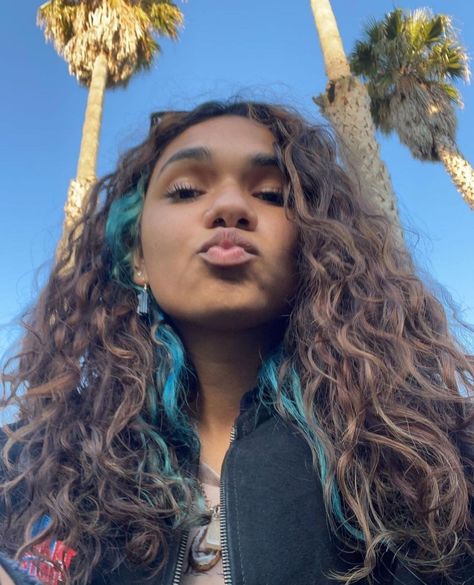 Color Streaks In Curly Hair, Colorful Streaks In Hair, Nonbinary Hairstyles, Underdye Hair Curly, Curly Hair Peekaboo Color, Money Piece Curly Hair, Blonde Streak, Blonde Streaks, Blonde Wavy Hair