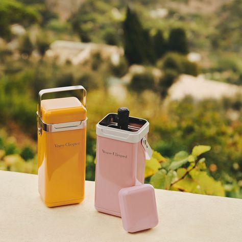 The Clicquot Cooler exemplifies Veuve Clicquot’s affinity for combining aesthetics and practicality to elevate everyday objects. ✨ Chic, casual and a must-have for picnics, this new object can easily be taken anywhere thanks to its chrome handle, keeping champagne at the optimal temperature for up to one hour. In a nod to the Maison’s cuvées, the two color choices - rosé or yellow - resemble the labels of its Brut and Rosé champagne bottles. It’s an object as elegant as it is essential 🍾. "On... Veuve Clicquot Aesthetic, Metal Cooler, Rosé Champagne, Veuve Cliquot, Champagne Brands, Perrier Jouet, Rose Champagne, Chrome Handles, Champagne Bottles