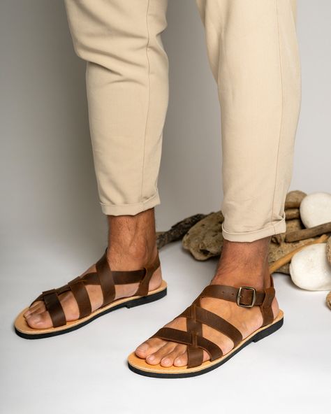 Timeless and classic, Greek leather sandals for men offer both comfort and durability. Handmade with high-quality leather from Crete, they are a must-have for any fashion-conscious man. Suitable for any occasion, their simple yet elegant design complements both casual and formal attire. Natural irregularities in color and texture add to their charm. SIZE GUIDE All genuine leather sandals can be stiff at the begging and widen after few days of wearing them.  If you wear a half size, choose the ne Brown Sandals Men, Men Sandals Outfit Casual Summer, Men Sandals Outfit, Sandals Outfit Casual, Male Sandals, Man Sandals, Leather Sandals For Men, Brown Shoes Men, Flat Leather Sandals