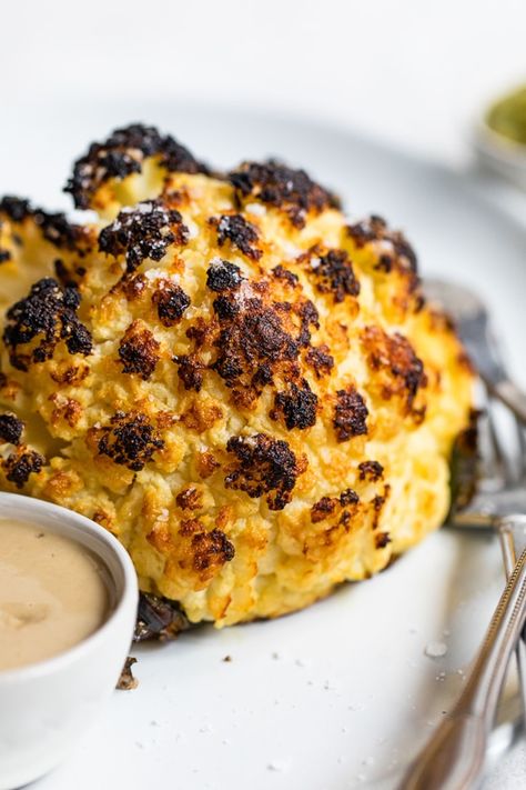 This simple, Whole Roasted Baby Cauliflower is perfectly charred on the outside and tender in the middle. Made with just four ingredients – salted water, extra-virgin olive oil, coarse sea salt—and cauliflower. #vegetarian #cauliflower Baby Cauliflower, Ww Sides, Flexitarian Recipes, Roasted Cauliflower Recipes, Whole Roasted Cauliflower, Cauliflower Recipe, Green Recipes, Eat Seasonal, Vegan Main Dishes