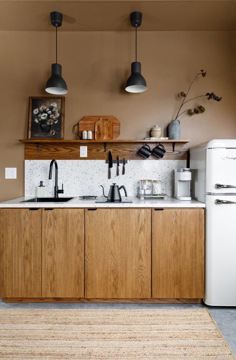 "We built the boxes of the cabinets, the fluted doors and stained and sealed all of them," she continues. Credit: <a href="https://www.allisoncorona.com/">Allison Corona</a> Air Bnb Kitchen, Kitchenette Ideas Guest Suite, Sleepout Ideas, Airbnb Kitchen, Studio Kitchenette, Mil Suite, Efficiency Apartment, Kitchenette Ideas, Kitchenette Design