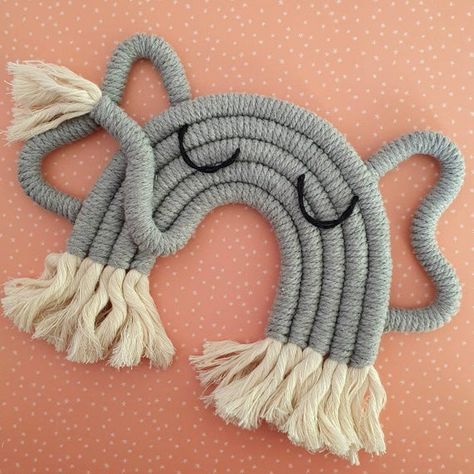 How adorable is this elephant!? 🐘 This Macrame Elephant would look beautiful in any childs safari bedroom or nursery! Perfect gift for a baby shower or new arrival. This elephant is made with a 100% grey cotton cord with Natural Cotton Fringing and Cotton sewn eyes. It is backed onto card to give Safari Nursery Wall, Simpul Makrame, Nursery Wall Hanging, Theme Bedroom, Handmade Elephant, Knitted Wire, French Knitting, Macrame Wall Hanging Diy, Animal Nursery Decor