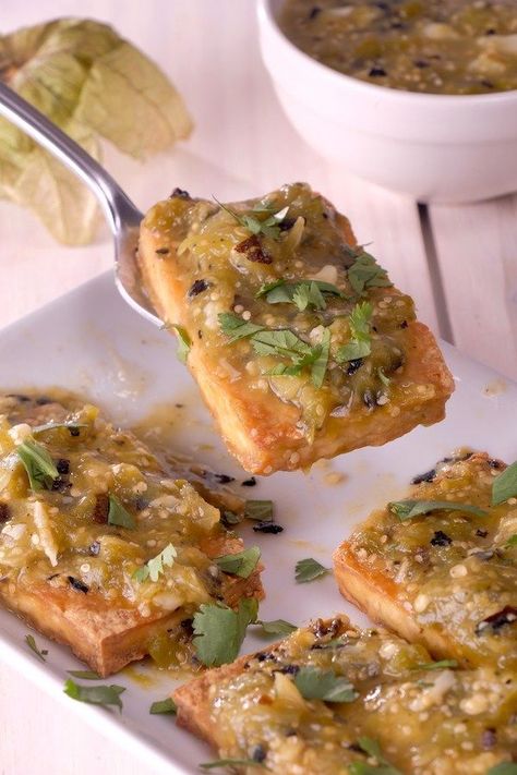 Baked Tomatillo Tofu - A zesty and flavorful baked tofu smothered in a roasted salsa verde. This simple plant-based protein recipe will be loved by all! #bakedtofu #vegan #glutenfree #tomatillorecipe #salsaverde #plantbased | meatlessmakeovers.com Tomatillo Recipes Vegan, Vegan Tomatillo Recipes, Roasted Salsa Verde, Meatless Food, Tomatillo Recipes, Roasted Salsa, Tofu Recipes Vegan, Protein Recipe, Tempeh Recipes