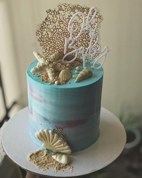 Vanilla Bean Cakes Cochin on Instagram: "This cake is going to be in my most favourite cakes list for a long long time ... Beach theme cake for a baby shower ... thanks @ann_thomas07 for ordering with us 🤗😍 #cakesofinstagram #beachthemecake #babyshowercake #bluepinkcake #cakesofinstagram #cakes #desserttable #desserts #macarons #cakesicles #babyshower #tripunithurabaker #kochihomebaker #homebaker" Beach Cake Gender Reveal, Surf Gender Reveal, Beach Themed Maternity Shoot, Beach Theme Baby Shower Ideas Girl, Baby Shower Beach Theme Girl, Surfer Baby Shower, Surfer Baby, Two Layer Cakes, Beach Themed Cakes