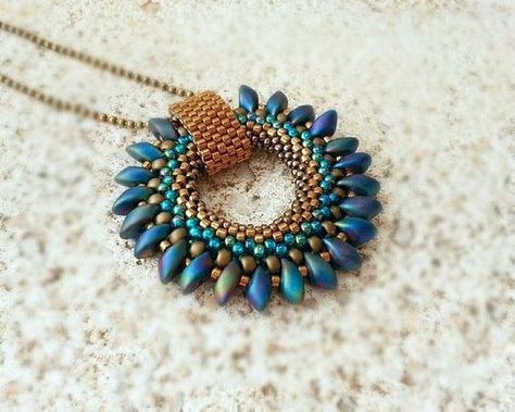 Bronze Blue Green Beaded Pendant with Magatama Beaded by ByElir: Focal Bead Necklace Ideas, Long Magatama Beads Pattern, Beaded Necklace Pendant, Seed Bead Jewelry Ideas, Seed Bead Pendant, Beaded Pendants, Duo Beads, Beadwork Necklace, Super Duo