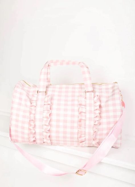 Gingham Ruffle Duffle Bag with Patches. Personalized. 0-2 patches included. An easy choice for a weekender bag, our Ruffle Duffle comfortably holds all of your getaway essentials--like packing cubes, a sweatshirt & Pouches--while still fitting under the seat of airplanes. Perfect to use as a gym bag, travel bag, overnight bag, baby bag, overnight bag for kids, daycare bag and more. Bag With Patches, Daycare Bag, Letter Patches, Holdall Bag, Kids Daycare, Outfits Petite, Sac Week End, Current Fashion, Packing Cubes