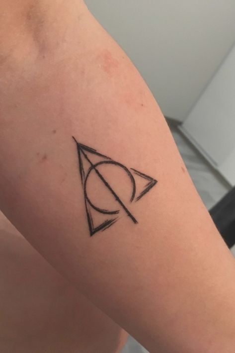 Tattoo uploaded by Jordan Francomme • Harry potter, the Deathly Hallows ☠ • 633426 • Tattoodo Harry Potter Deathly Hallows Tattoo, Harry Potter Triangle, Best Wrist Tattoos, Harry Potter The Deathly Hallows, Hallows Tattoo, Harry Tattoos, Hp Tattoo, Simple Tattoos For Guys, Cool Wrist Tattoos