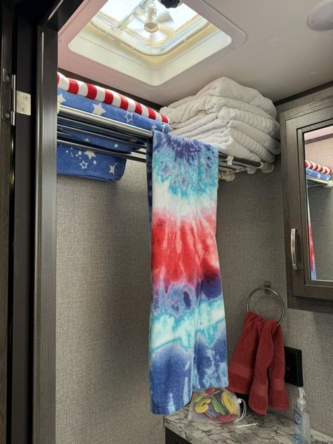 RV Hacking Camping Ideas | Couldn’t figure out where to store my towels so they wouldn’t take up a whole closet | Facebook Small Camper Clothes Storage Ideas, Rv Towel Storage Ideas, Rv Closet Storage Ideas, Camper Cat, Dirty Laundry Storage, Jacket Storage, Happy Glamper, Camper Hacks, Rv Organization