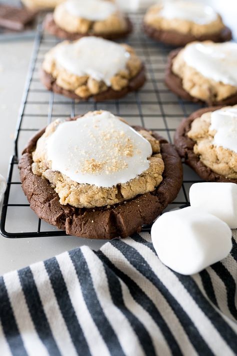 smores brownie cookies on a black cookie cooling rack with large marshmallows in the frame Smores Brownie Cookies, Crumbl Cookie Copycat Smores Brownie, Crumbl Cookie Smores, Smores Crumbl Cookies, Double Fudge Brownie Crumbl Cookies, Smores Crumble Cookie, Crumbl Cookie Copycat Smores, Cool Cookie Recipes, Graham Cracker Cookie Dough