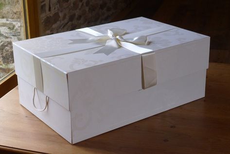 How To Store A Wedding Dress [Keep It Safe And Looking Good] Wedding Dress Box Packaging, Dress Box Packaging, Large Wedding Dress, Wedding Box Design, Wedding Preservation, Wedding Dress Box, Wedding Dress Storage, Pretty White Dress, Dress Storage