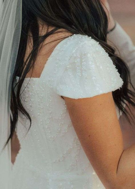 Modest beading and pearl wedding dress with cap sleeves || Modest bridal dress with delicate pearl beading and cap sleeves || Utah Bridal Shop Salt Lake city Bride || Photo by Riley Kathleen Photo Modest Wedding Dresses With Pearls, Cap Sleeve A Line Wedding Dress, Sparkly Wedding Dress Modest, Wedding Dress With Cap Sleeves, Christian Wedding Dress, Modest Bridal Dresses, Cap Sleeve Wedding Dress, Wona Concept, Chic Bridal Gown