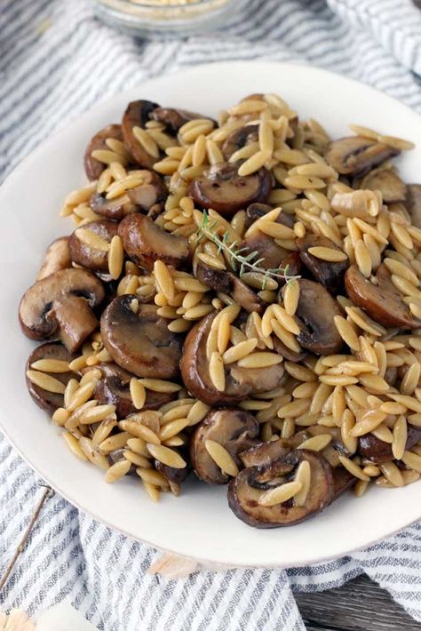 Close up of orzo and mushrooms on a white plate with a sprig of thyme on top Orzo With Mushrooms, One Pot Orzo, Orzo Recipes, Vegetarian Sides, Rachel Ray, Browned Butter, Biscuit Recipe, Mushroom Recipes, Orzo