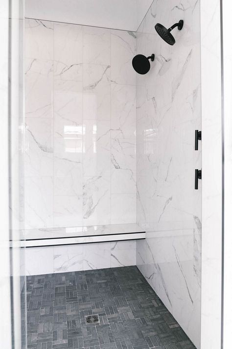 New-construction Black Modern Farmhouse - Home Bunch Interior Design Ideas White Marble Shower Dark Floor, Statuario Porcelain Tile Bathroom, Black And White Marble Shower Tile, 12x24 Carrara Shower Wall Tile, White 12x24 Shower Wall Tile, Split Tile Bathroom, Shower Trim Tile, Porcelain Shower Wall Tile, 24x12 Shower Wall Tile