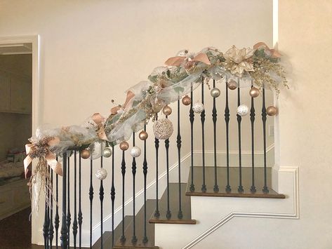 Christmas Banister Ideas, White And Gold Christmas Decor Stairs, White Gold Silver Christmas Mantle, Garland Table Runner Christmas Gold White Silver, Xmas Stairs, Ornament Garland Staircase, Christmas Garland Staircase, Disney Banister Garland Christmas, Silver Gold Christmas