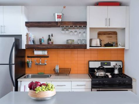 These 20 Colorful Kitchens Will Make You Want to Kiss Your Neutral Kitchen Goodbye Orange Backsplash Kitchen, Brick Loft Apartment, Orange Backsplash, Colorful Kitchen Ideas, Colorful Kitchens, Kitchen Styling Modern, Condo Kitchen, Neutral Kitchen, Brick Loft