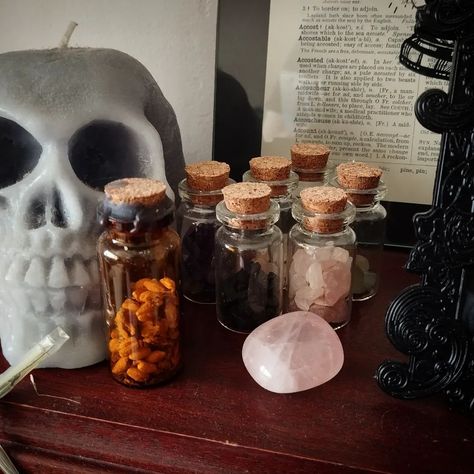 Potion bottles, bottles of crystal chips and a spell bottle. I do love my little ever growing collection 🖤 Do you have witchy stuff out on display at home? #potionbottles #spellbottles #witchestools #witchcrafting #witchaesthetic #witchylife #witchyvibes #witchythings #witchystuff #witchylife #witchylifestyle #witchlife #witchaesthetic #witchcasket Apothecary Ideas, W.i.t.c.h Aesthetic, Potion Bottles, Crystal Chips, Witchy Stuff, Potion Bottle, Witchy Vibes, June 19, Do Love