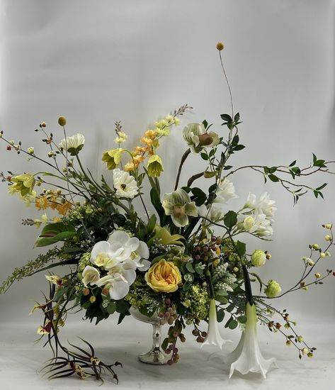 This is a beautiful year round centerpiece, made with top quality flowers made on a high quality ceramic silver vaseI used roses, Anemones, orchids. queen ann’s lace, cherry blossom, peonies, angel trumpets, hydrangeas, freesias, branches,and lots of different greenery.Approximately 28” wide a Yellow Flower Centerpieces, Trumpet Vase Centerpiece, Silk Floral Centerpiece, Tall Flower Arrangements, Branch Centerpieces, White Flower Arrangements, Yellow Orchid, Spring Arrangements, Corporate Flowers