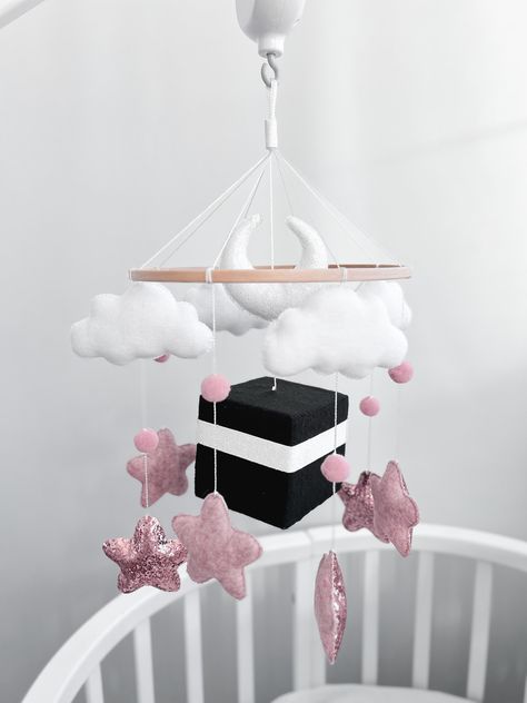 Introducing a beautifully crafted handmade nursery mobile featuring a felt Kaaba! Made with love and attention to detail, this mobile is the perfect addition to baby's room. The felt Kaaba, a symbol of the Islamic faith, has been carefully handcrafted to ensure that every detail is captured. It hangs at the center of the mobile, surrounded by a ring of felt clouds, stars in shades of white, sliver or gold. The mobile is easy to hang and can be adjusted to suit your baby's sightline. It is also l Islamic Nursery, Luxury Baby Room, Baby Room Inspiration, Nursery Room Inspiration, Mobile Baby, Baby Crib Mobile, Diy Clothes Life Hacks, Nursery Mobile, Future Mom