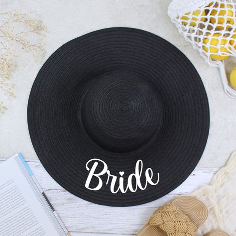 👒�💍 Say "hello" to sunny days and sweet forever afters with our Personalised Bride Hat! Perfect for destination weddings, honeymoons, or that fun bachelorette getaway. Customise this chic sun hat with your new married name and choose from classy black or elegant beige to match your style. Whether you’re lounging by the beach or partying poolside, let everyone know you’re the bride with this stylish statement piece! 👰‍♀️🌞 #MrsInTheSun #BrideToBe #DestinationWedding #HoneymoonEssentials #Bachel... Honeymoon Essentials, 20th Birthday Gift, Hen Party Gifts, Wedding Roles, 90th Birthday Gifts, Bride Hat, Grandad Gift, 80th Birthday Gifts, Bridemaids Gifts